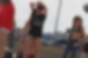A group of teens in bikinis on the beach