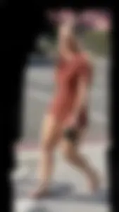 Summer blond in orange showing cheeks