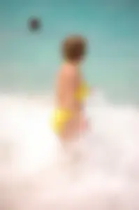 Assortment of sexy babes at the beach in bikinis