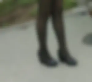 Legs in Black Pantyhose and High Heeled Shoes Street Closeup