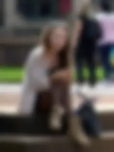 Cute Girl in Dark Pantyhose Sitting With Crossed Legs on a Step Street Creepshot
