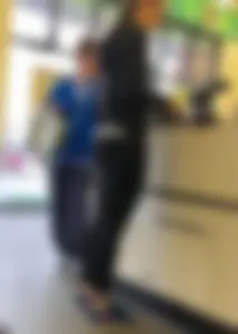 Thick booty girl shopping at Dollar Tree in leggings