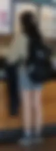 Slender asian teen oblivious at the cafe