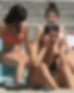 Bunch of sexy babes at the beach in bikinis