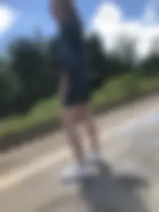 Cute candid girl in a dress at the train station