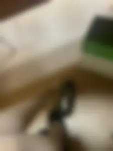 College girl's feet in pantyhose with flats taken off under desk photo