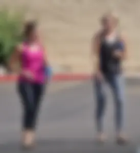 Skinny blonde in grey leggings with a friend