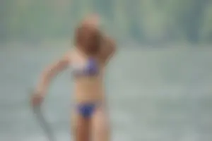 Skinny teen having fun in her little England bikini