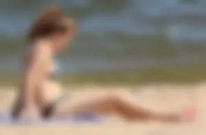 Two sexy beach teens in bikinis, one thick and one skinny with big boobs