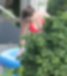Thick babe in the backyard in red bikini