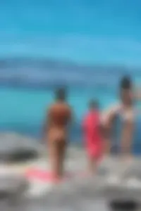 Older lady on a nude beach showing her body