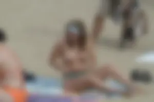 Topless girls on a beach in Barcelona