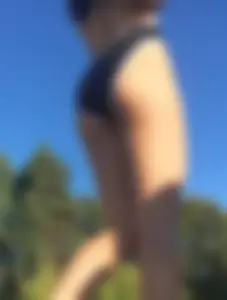 Sexy bikini babe up close removing her shorts and showing her tight ass in a bikini