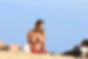 Sexy girls topless on a nude beach showing their nice tits