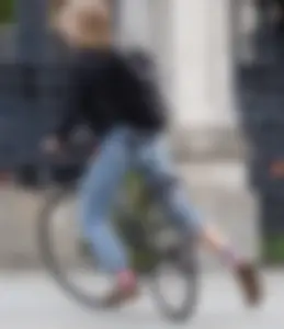 Cute Girl in Jeans on the Bike Candid Photos