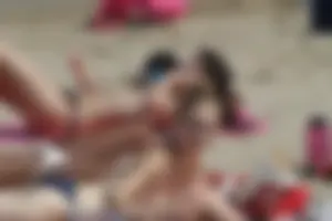 Girls on a nude beach in Sitges, Spain