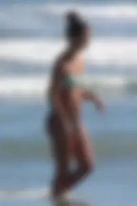 Beach girl out in a bikini with a nice round big booty