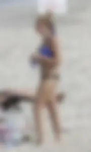Florida blonde in blue and black bikini on the beach