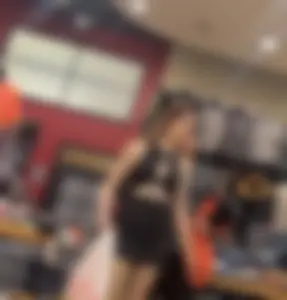 Redhead goth girl  in fishnets + tight dress