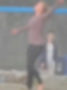 Beach volleyball blonde lady in tight leggings
