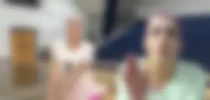 Bunch of cute college girls in bright pink shorts playing volleyball