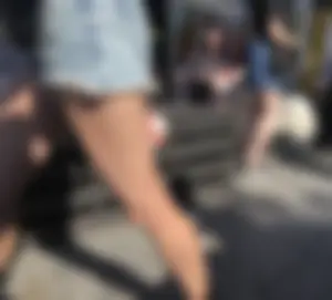 Girl in Denim Shorts with Amazing Hot Legs Fixing Her Sandals Street Candid Photo Gallery