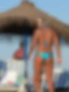 A bunch of hot babes on the beach in thong bikinis