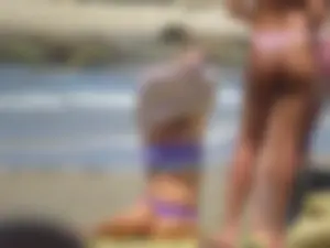 Girl with a great ass in thong bikini on the beach