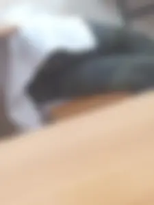 College Teen in Camouflage Pants Lying on the Classroom Bench Creepshot