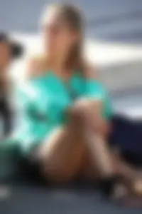 Blonde lady upskirted showing her panties and pussy lips