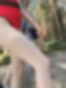Young Girl in a One-Piece Swimsuit Walking on a Forest Road Photo Gallery