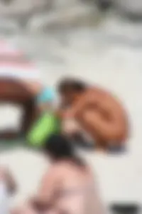 Older lady on a nude beach showing her body
