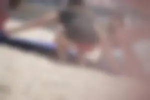 A group of teens in bikinis on the beach