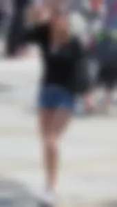 Cute girl with nice legs in short denim shorts
