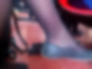 Legs and Feet in Flats of a College Female Student Sitting Cross-Legged Closeup Candid Creepshot