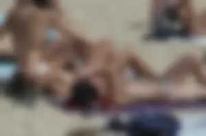 Topless girls on a beach in Barcelona