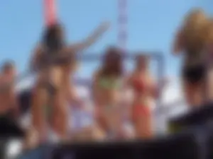 Party girls looking sexy out on boats in bikinis