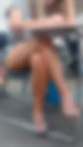 Hot college girl's legs crossed under desk and feet in slippers, creepshot in class