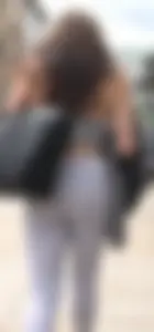Sexy girl in see through grey leggings showing her thong
