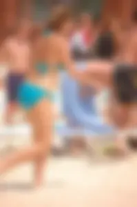 Assortment of sexy babes at the beach in bikinis