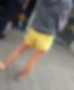 Skinny ass eating her yellow shorts