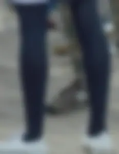 Slim legs in black pantyhose street closeups