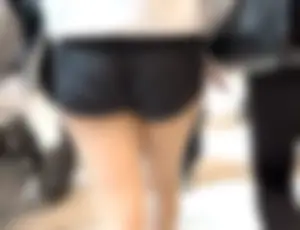 Asian girl in tight black shorts at the mall