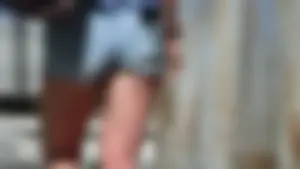 Amazing butt of a street candid girl wearing denim mini shorts passing by