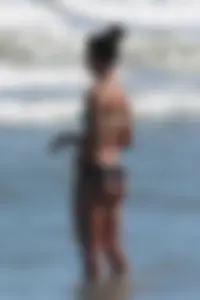 Beach girl out in a bikini with a nice round big booty