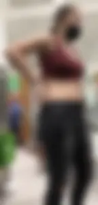 Latina in Maroon crop top and tight black jeans
