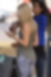 Hot blonde in light leggings after getting Starbucks