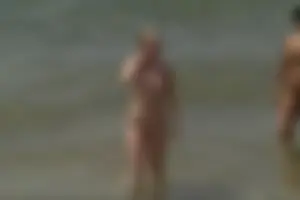 Girls on a nude beach in Sitges, Spain