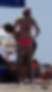 Sexy and skinny girl on the beach in pink bikini