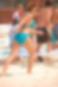 Assortment of sexy babes at the beach in bikinis